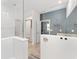 Modern bathroom with double sinks and walk-in shower at 6115 Sw 74Th Ct, Ocala, FL 34474