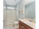 Clean bathroom with walk-in shower and vanity at 6115 Sw 74Th Ct, Ocala, FL 34474