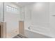 Bathroom with soaking tub, shower, and glass enclosure at 6115 Sw 74Th Ct, Ocala, FL 34474