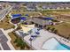 Aerial view of community playground and pool area at 6115 Sw 74Th Ct, Ocala, FL 34474