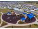Aerial view of community pool, playground, and clubhouse at 6115 Sw 74Th Ct, Ocala, FL 34474