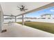 Covered patio with ceiling fan, string lights, and outdoor dining set at 6115 Sw 74Th Ct, Ocala, FL 34474