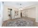 Open dining area with a view into the kitchen and staircase at 6115 Sw 74Th Ct, Ocala, FL 34474