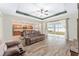 Living room with open floor plan and view of the kitchen and backyard at 6115 Sw 74Th Ct, Ocala, FL 34474