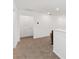 Spacious loft area with carpeted flooring and door at 6115 Sw 74Th Ct, Ocala, FL 34474