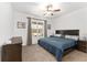 Spacious main bedroom with ceiling fan and large window at 6115 Sw 74Th Ct, Ocala, FL 34474