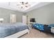 Spacious main bedroom with a view of the bathroom and an additional sleeping area at 6115 Sw 74Th Ct, Ocala, FL 34474