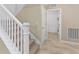 Staircase with white railings and carpeted steps at 6115 Sw 74Th Ct, Ocala, FL 34474