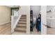 Stairs leading to upper level with storage under at 6115 Sw 74Th Ct, Ocala, FL 34474