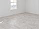 Bright bedroom with tile flooring and window at 7405 Sw 61St St, Ocala, FL 34474