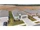 One story home with gray exterior, two-car garage, and landscaped yard; aerial view at 9229 Sw 52Nd Place Rd, Ocala, FL 34481