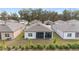 Aerial view of houses with backyard patios and screened lanais at 9229 Sw 52Nd Place Rd, Ocala, FL 34481