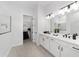 Modern bathroom with double vanity, walk-in shower, and closet at 9229 Sw 52Nd Place Rd, Ocala, FL 34481