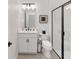 Modern bathroom with white vanity, frameless shower, and updated fixtures at 9229 Sw 52Nd Place Rd, Ocala, FL 34481