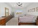 Spacious bedroom with wood flooring and large window at 9229 Sw 52Nd Place Rd, Ocala, FL 34481