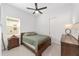 Bright bedroom with a double bed, nightstand, and ample closet space at 9229 Sw 52Nd Place Rd, Ocala, FL 34481
