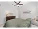 Guest bedroom with a queen bed, dresser, and ceiling fan at 9229 Sw 52Nd Place Rd, Ocala, FL 34481