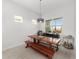 Rustic dining room with large windows and a wooden table at 9229 Sw 52Nd Place Rd, Ocala, FL 34481