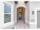 Covered entryway with tile floor and arched doorway at 9229 Sw 52Nd Place Rd, Ocala, FL 34481
