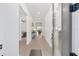 Bright hallway with light wood floors, leading to living spaces at 9229 Sw 52Nd Place Rd, Ocala, FL 34481