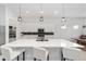 Modern kitchen with white cabinets, quartz countertops and island at 9229 Sw 52Nd Place Rd, Ocala, FL 34481