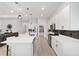 Modern kitchen with white cabinets, quartz countertops and island at 9229 Sw 52Nd Place Rd, Ocala, FL 34481