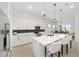 Modern kitchen with white cabinets, quartz countertops, and island at 9229 Sw 52Nd Place Rd, Ocala, FL 34481
