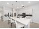 Modern kitchen with white cabinets, quartz countertops and island at 9229 Sw 52Nd Place Rd, Ocala, FL 34481