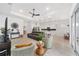 Open living area showcasing a stylish sectional sofa and kitchen at 9229 Sw 52Nd Place Rd, Ocala, FL 34481
