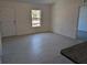Bright living room with tile floors and access to kitchen at 963 Sw Temple Heights Ct, Dunnellon, FL 34431