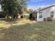 Large backyard with grassy area and partial house view at 10814 Sw 83Rd Ave, Ocala, FL 34481