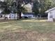 Backyard view showing a large grassy area and trees at 10814 Sw 83Rd Ave, Ocala, FL 34481