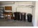 Garage with shelving, workbench, and trash cans at 10814 Sw 83Rd Ave, Ocala, FL 34481