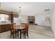 Dining area with a wood table and chairs, adjacent to the kitchen at 1105 Ne 17Th Ne Ter, Ocala, FL 34470