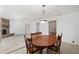 Dining area with wood table and chairs near kitchen and fireplace at 1105 Ne 17Th Ne Ter, Ocala, FL 34470