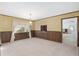 Dining room with wood paneling, patterned wallpaper and views to other rooms at 1105 Ne 17Th Ne Ter, Ocala, FL 34470