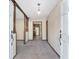 Bright entryway with wood columns, neutral carpeting, and views into adjacent rooms at 1105 Ne 17Th Ne Ter, Ocala, FL 34470