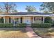 Front entrance with double doors and columned porch at 1105 Ne 17Th Ne Ter, Ocala, FL 34470