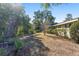 Side yard of ranch house with walkway and landscaping at 1105 Ne 17Th Ne Ter, Ocala, FL 34470