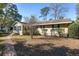 Side view of ranch house with walkway and landscaping at 1105 Ne 17Th Ne Ter, Ocala, FL 34470