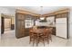 View of kitchen with wood cabinets, a round table, and white appliances at 1105 Ne 17Th Ne Ter, Ocala, FL 34470