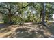 Fenced yard with mature trees and open space at 1105 Ne 17Th Ne Ter, Ocala, FL 34470