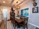 Farmhouse-style dining room with wooden table and rustic decor at 14515 Ne 110Th Avenue Rd, Fort Mc Coy, FL 32134