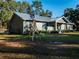 House with windmill and landscaped yard at 14515 Ne 110Th Avenue Rd, Fort Mc Coy, FL 32134