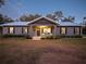 Charming ranch home with metal roof and landscaped yard at 14515 Ne 110Th Avenue Rd, Fort Mc Coy, FL 32134