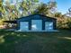 Large three-car garage with covered patio at 14515 Ne 110Th Avenue Rd, Fort Mc Coy, FL 32134