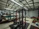 Garage with boat and weightlifting equipment at 14515 Ne 110Th Avenue Rd, Fort Mc Coy, FL 32134