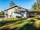 Gray house exterior with white door and AC unit at 14515 Ne 110Th Avenue Rd, Fort Mc Coy, FL 32134