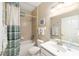 Clean bathroom with tub, shower, and updated vanity at 16182 Sw 14Th Ave Rd, Ocala, FL 34473