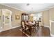 Formal dining room with hardwood floors and elegant chandelier at 16182 Sw 14Th Ave Rd, Ocala, FL 34473